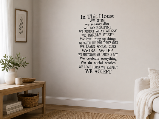 Black In This House We Stim removable wall decal displayed in a calm cozy living room with warm neutral decor.