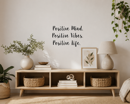 Positive Mind Positive Vibes Positive Life removable wall decal displayed above a timber entryway bench in a neutral modern home interior.