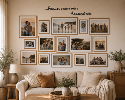 Because a Picture is Worth a Thousand Words removable wall decal above a family photo gallery wall in a warm neutral modern home with wooden frames.