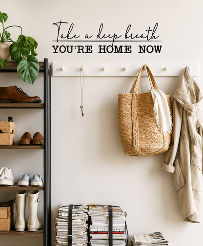 Take a Deep Breath You're Home Now removable black wall decal displayed in a modern home entrance hallway.
