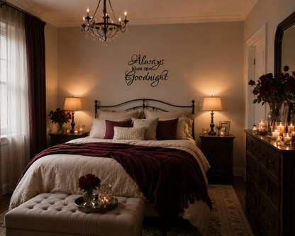 Romantic bedroom featuring an “Always Kiss Me Goodnight” black wall decal above the bed with warm lighting, cozy bedding, candles, and elegant modern farmhouse décor.