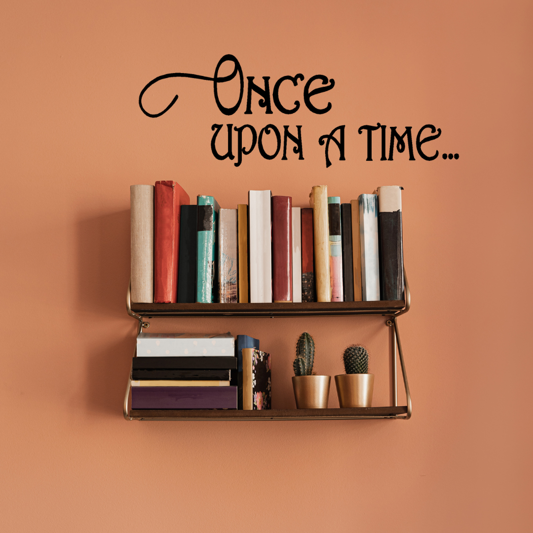 Children's bedroom with a bed, teddy bear, and decorative pillows, featuring a 'Once Upon a Time' wall decal. Two Little Giggles Wall Decal