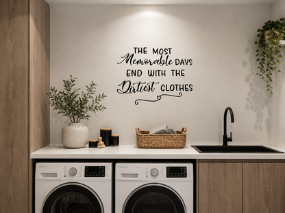 Modern laundry room with neutral tones featuring “The Most Memorable Days End With the Dirtiest Clothes” removable wall decal above washing machines, styled with woven basket and greenery.