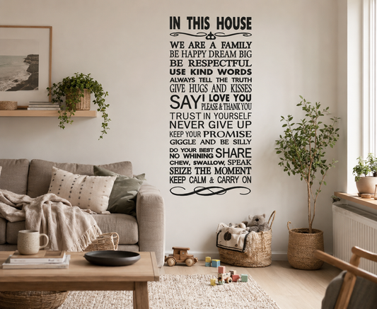 Large black “In This House” family rules wall decal displayed in a warm Scandinavian style dining room with timber furniture and relaxed neutral décor.