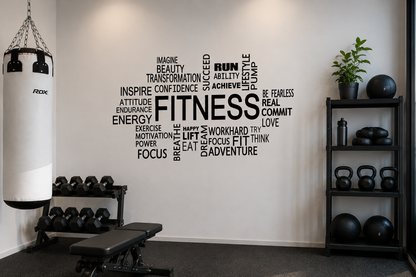 Black fitness motivation wall decal displayed in a modern home gym with weights, punching bag and neutral industrial styling.