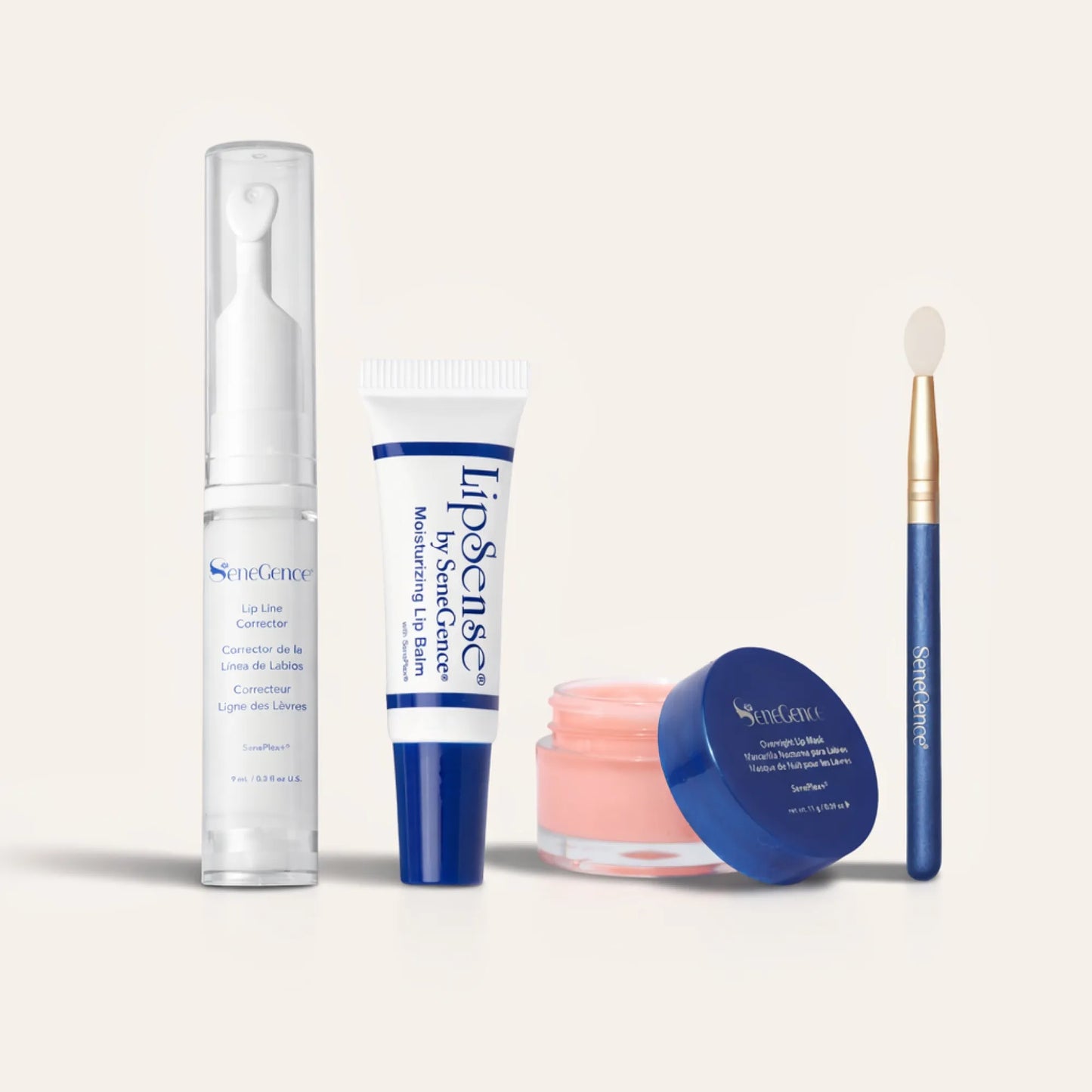 Ultimate Lip Care Collection NZL lineup with Lip Line Corrector in a tall clear pump, a white blue lip balm tube, a pink lip mask jar, and a blue handle applicator brush