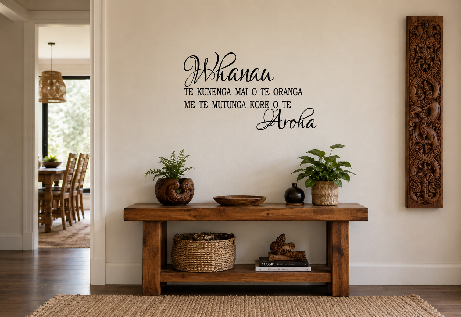 Whānau Māori-inspired removable vinyl wall decal displayed in a warm modern hallway with natural wooden furniture and Māori carving décor.