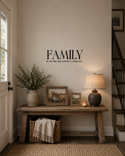 Family wall decal featuring the quote "The Best Thing About Memories Is Making Them" displayed above a rustic console table with framed family photos in a warm family home.