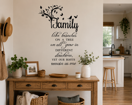 Family quote wall decal with tree branches and birds displayed in a warm neutral living room with wooden bench seating, woven baskets, plants and soft Scandinavian-inspired decor.