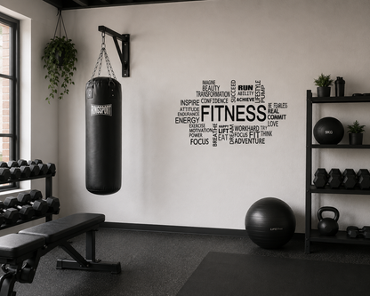 Black fitness motivation wall decal displayed in a modern home gym with weights, punching bag and neutral industrial styling.