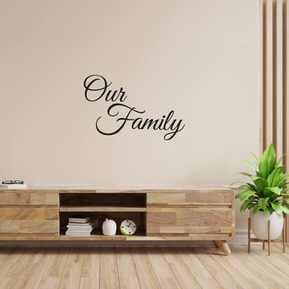 Decorative wall decal with 'Our Family' text on a gray wall. Two Little Giggles Wall Decals