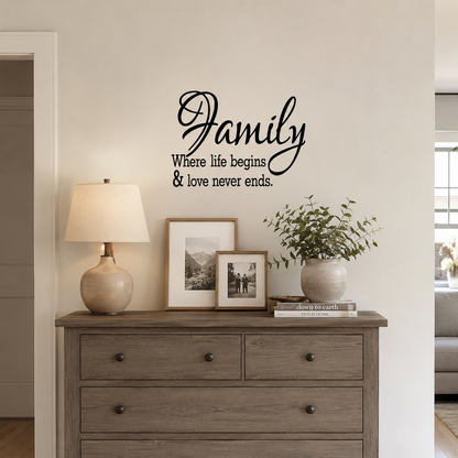 “Elegant ‘Family – Where life begins & love never ends’ wall decal in a softly styled living room above a wooden shelving unit with books and home décor accents.”