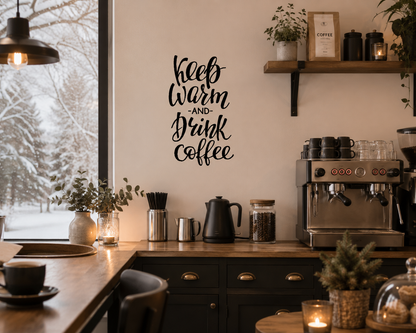 Keep Warm and Drink Coffee removable wall decal displayed above a coffee station in a cosy café-style kitchen