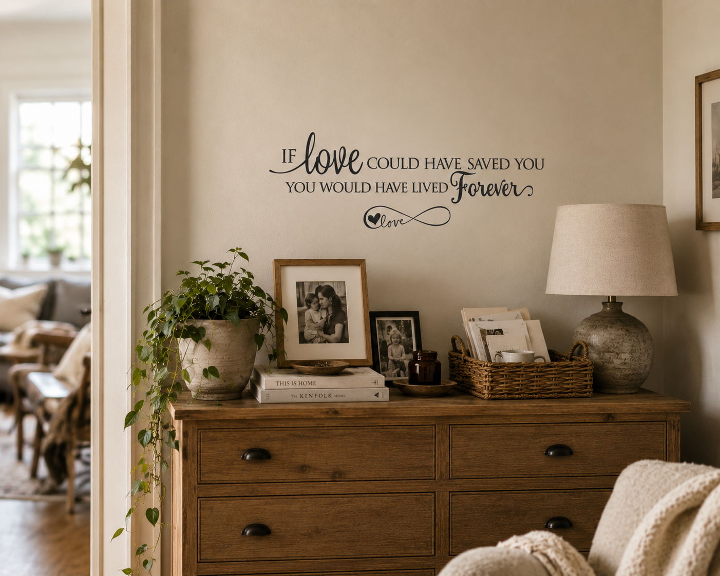 Wooden dresser with decorative items and a wall quote in a home setting