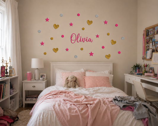 Warm and cozy girls’ bedroom featuring a personalised “Olivia” wall decal surrounded by scattered hot pink butterfly silhouettes, stars, dots, and gold heart decals. The neutral-toned room includes wooden furniture, soft natural textures, a toy tea table, plush teddy bear, bookshelf, and whimsical fairy door décor, creating a calm and playful nursery atmosphere.