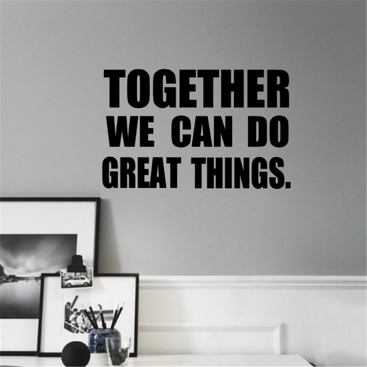 Motivational quote 'Together We Can Do Great Things' wall decal on a gray wall with decor elements.